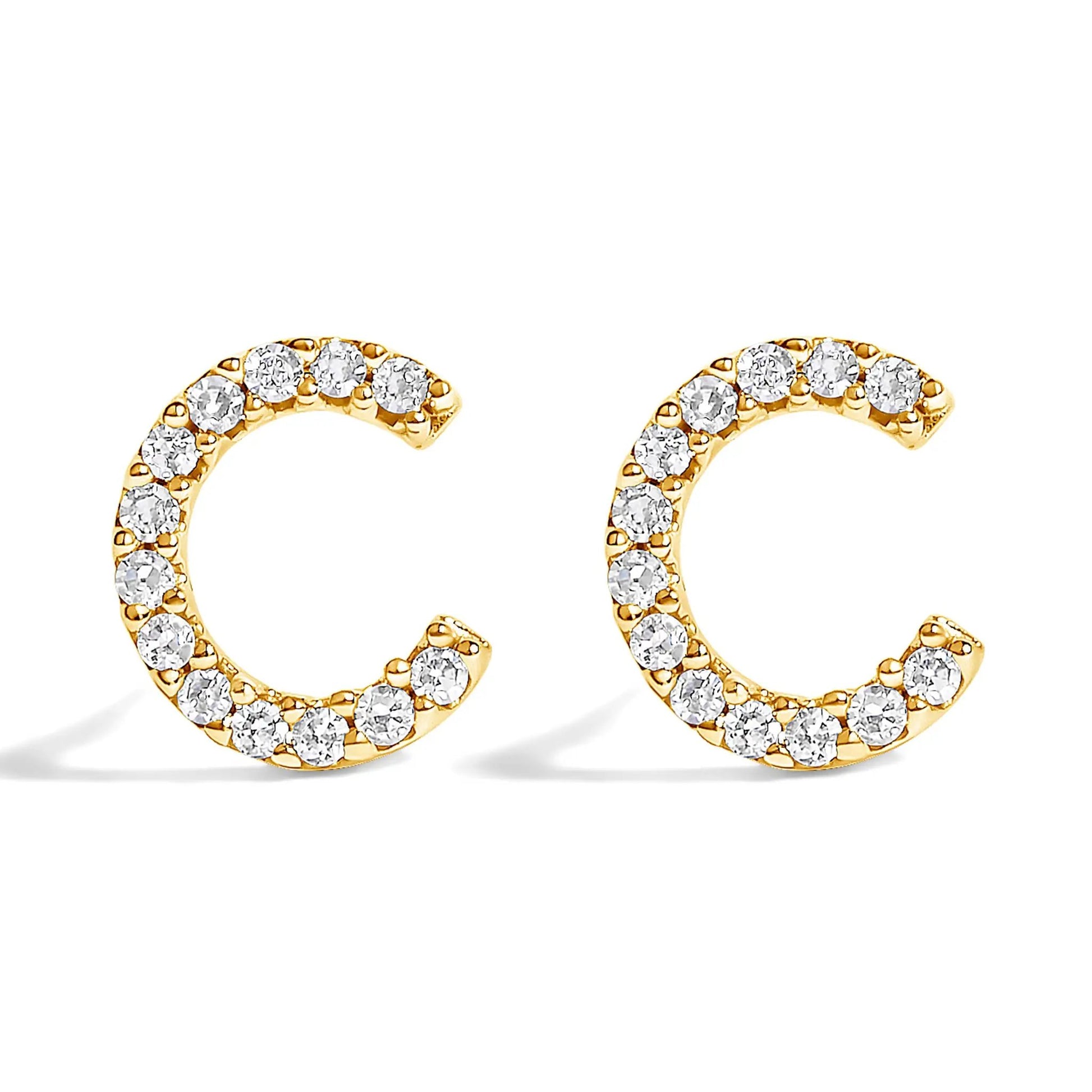 Gold-tone diamond-studded hoop earrings with pavé crystals along curved band on Tampa Home & Garden Store