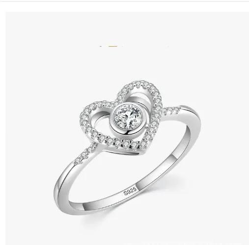 Heart-shaped sterling silver ring with pavé halo around a solitaire center stone; S925 band on Tampa Home & Garden Store