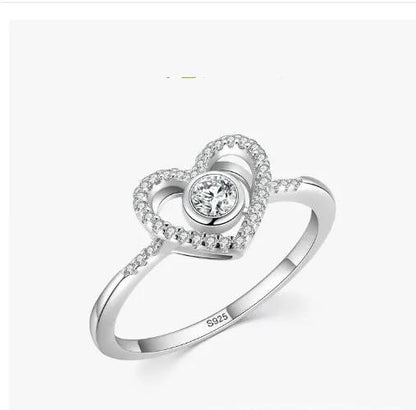 Heart-shaped sterling silver ring with pavé halo around a solitaire center stone; S925 band on Tampa Home & Garden Store