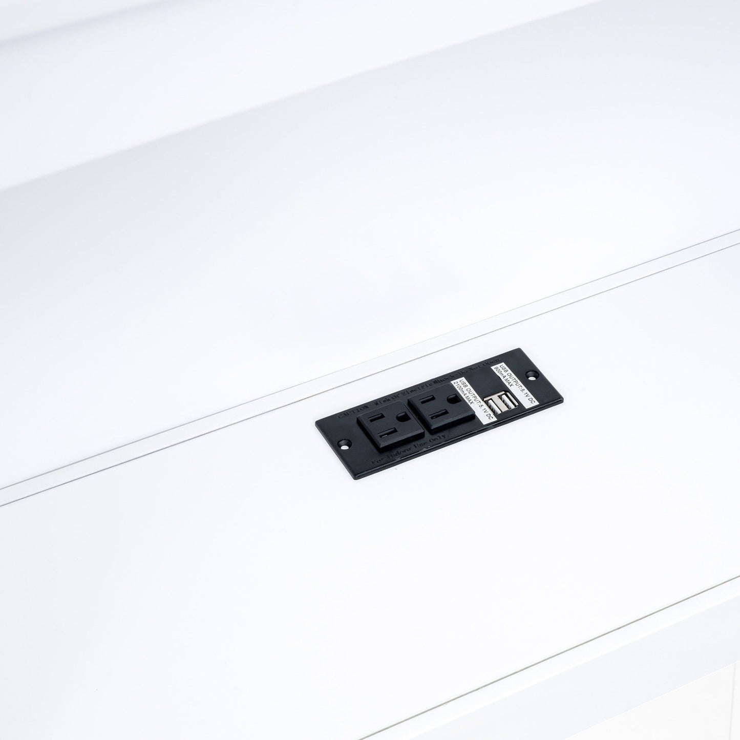 Black power strip with USB ports resting on a white surface on Tampa Home & Garden Store