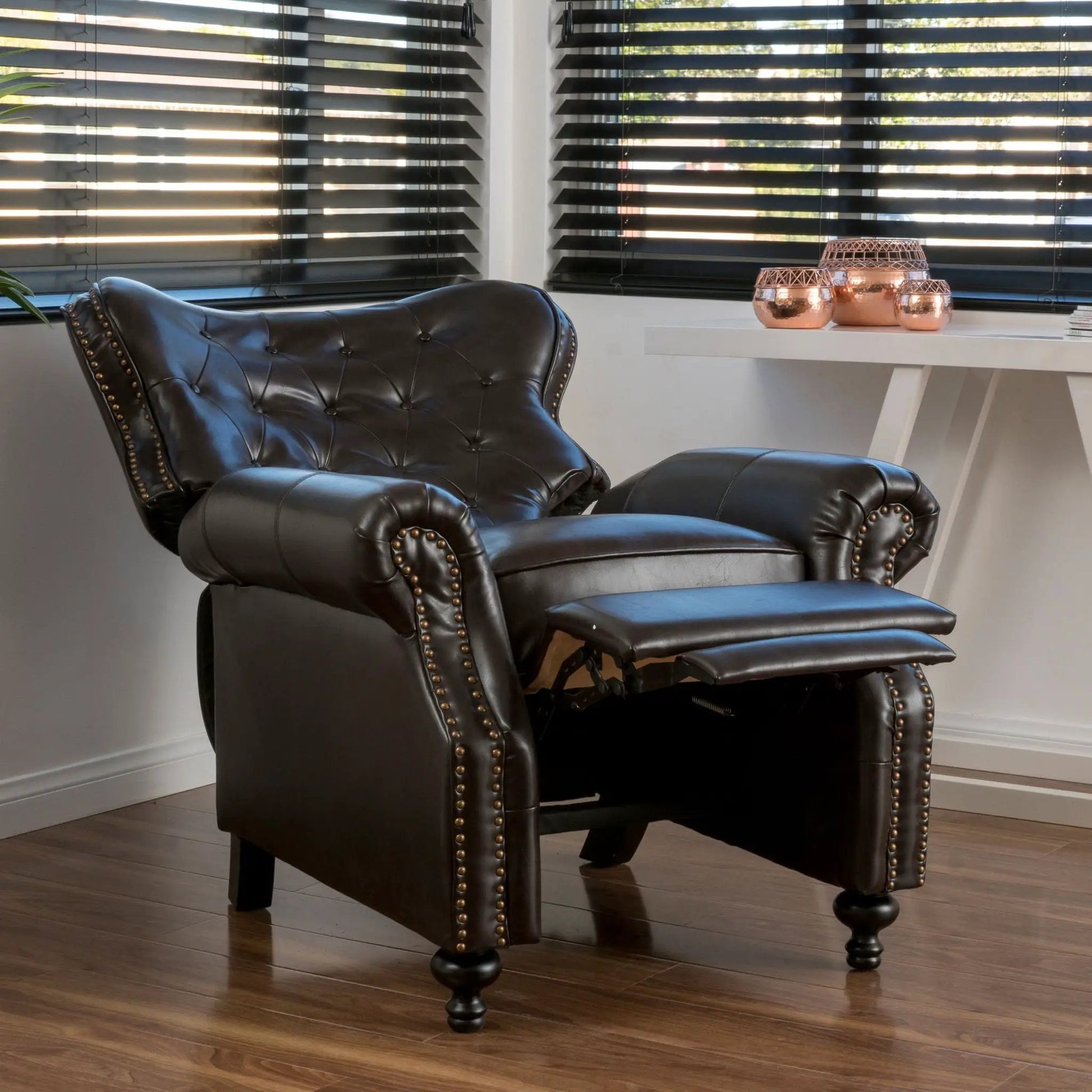 Contemporary style push-back recliner with button tufting and nailhead trim in black leather on Tampa Home & Garden Store