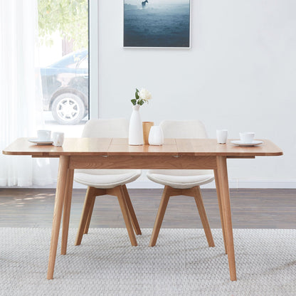 Telescopic wood dining table with extendable top in natural finish, four light upholstered chairs on Tampa Home & Garden Store