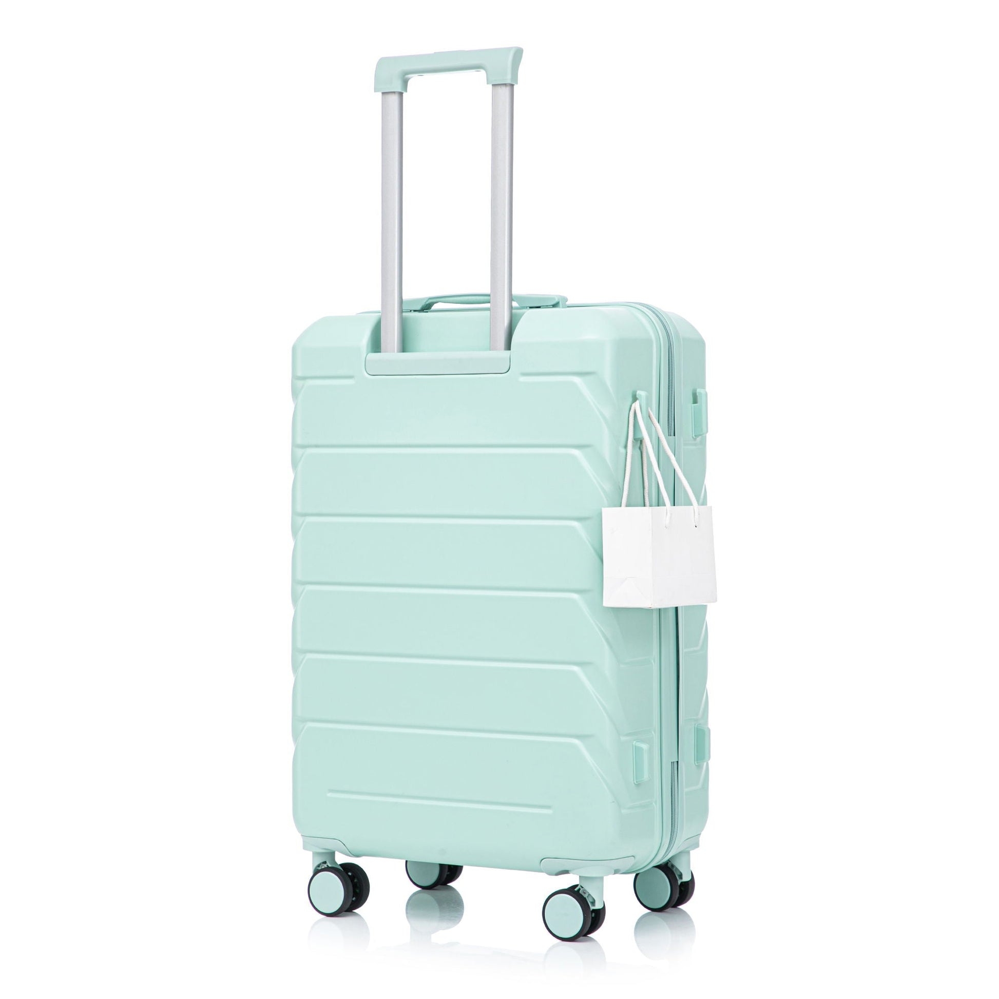 Mint green spinner luggage with extendable handle and tag on Tampa Home & Garden Store