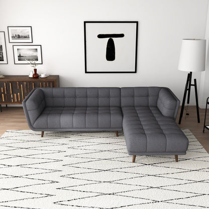 L-shaped tufted sectional sofa in dark gray with mid-century modern design on Tampa Home & Garden Store