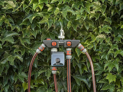 Gardena Water Control Bluetooth watering controller with red hoses and mounting hub on Tampa Home & Garden Store
