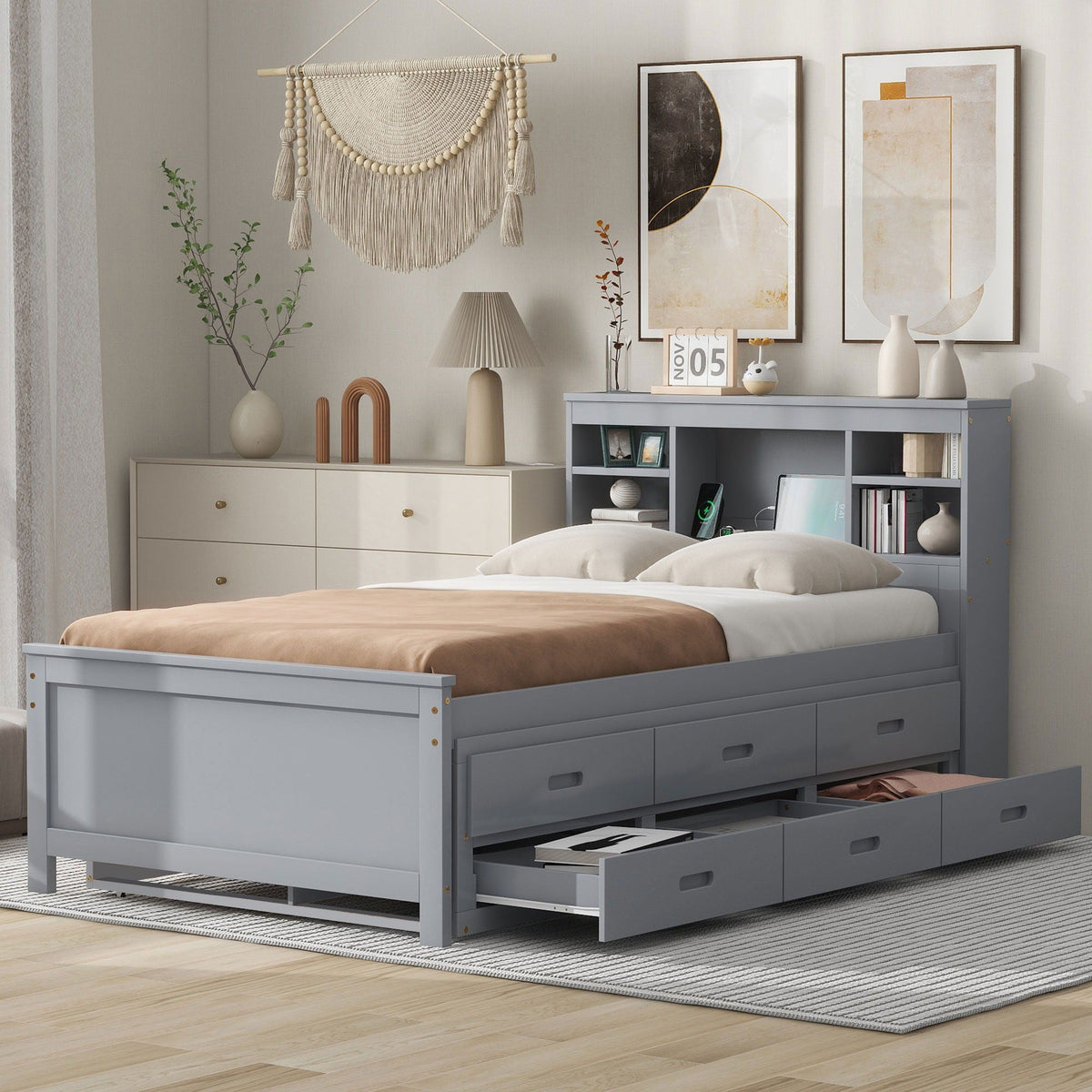 Gray platform bed with built-in storage drawers under the frame in a modern bedroom on Tampa Home & Garden Store