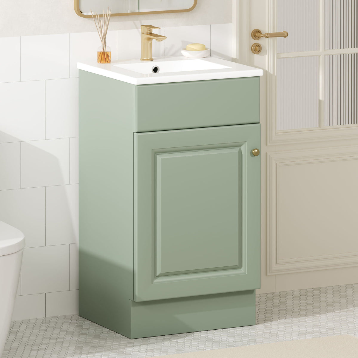 Bathroom vanity with sink in sage green, white countertop, and gold faucet in bathroom on Tampa Home & Garden Store
