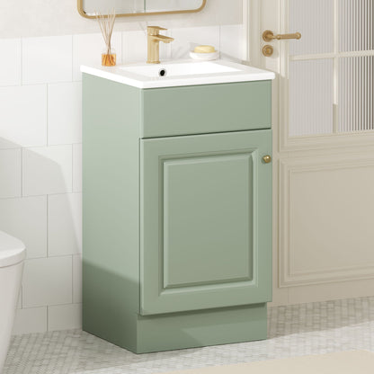 Bathroom vanity with sink in sage green, white countertop, and gold faucet in bathroom on Tampa Home & Garden Store
