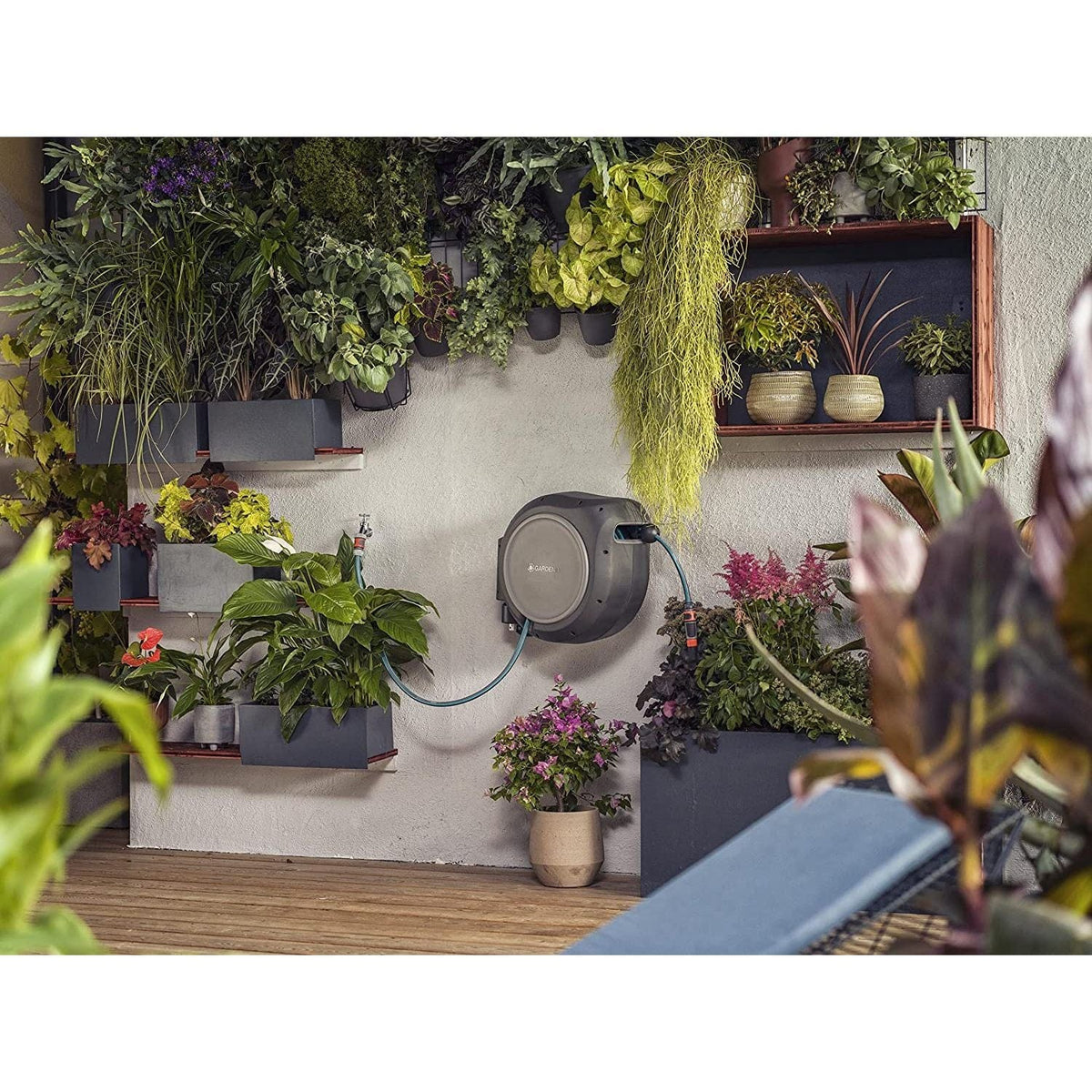 Gardena RollUp 75 ft retractable hose reel, gray body with blue hose, wall-mounted on Tampa Home & Garden Store