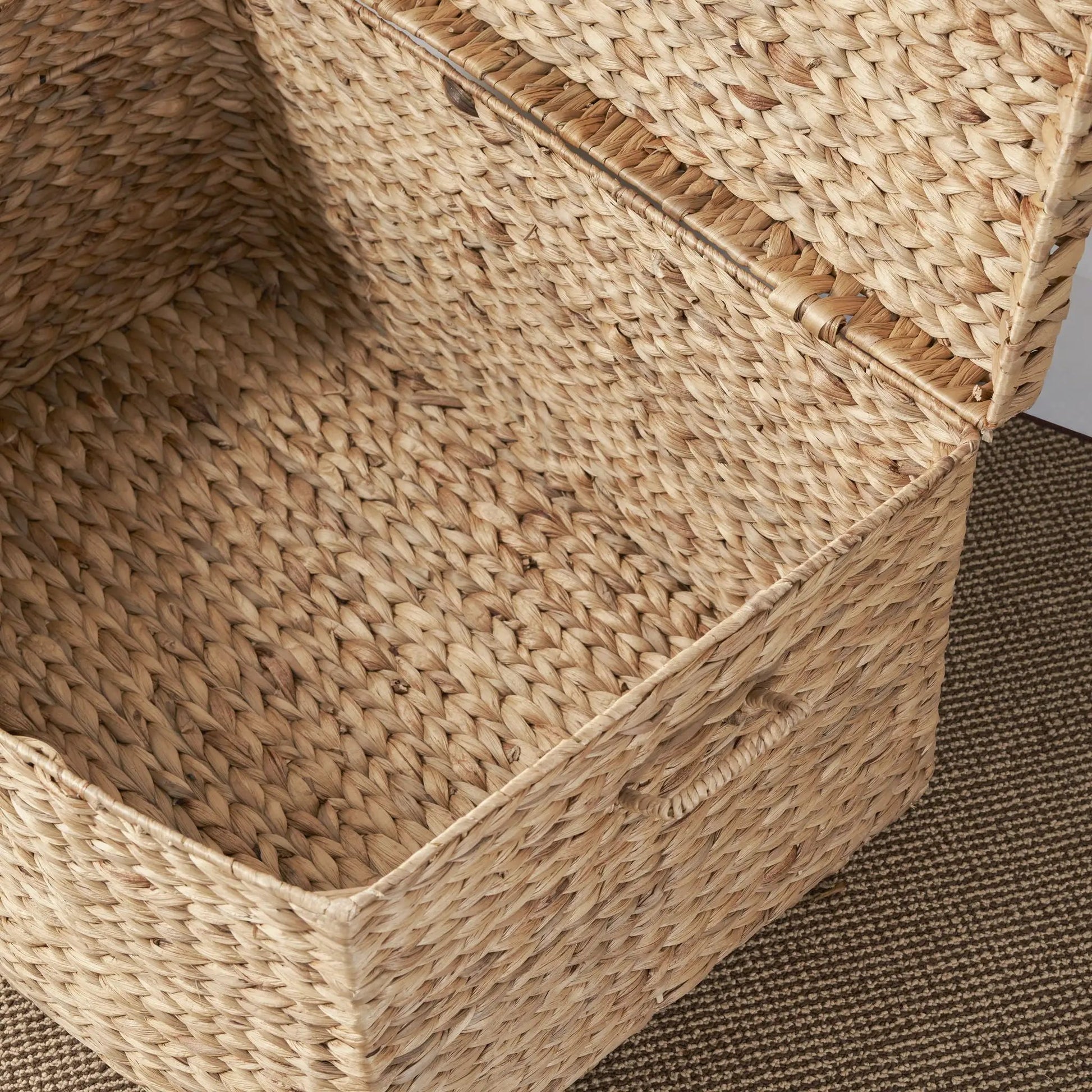 Rectangular water hyacinth storage trunk with curved woven handles in natural brown on Tampa Home & Garden Store