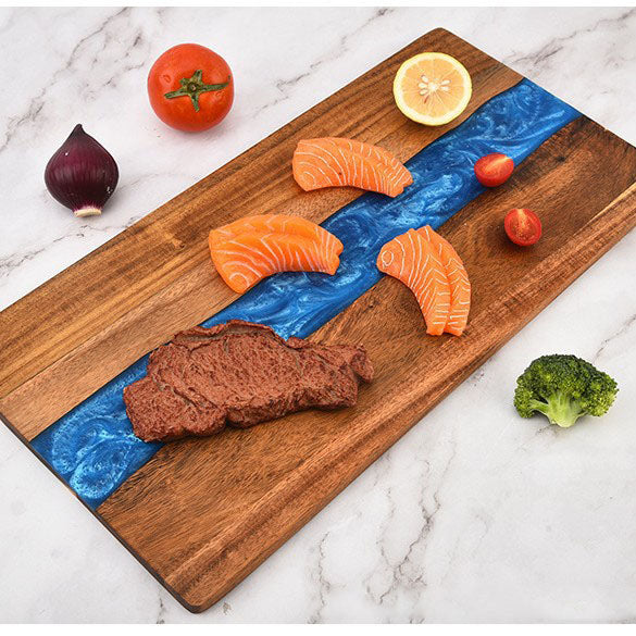 Acacia wood large charcuterie board with blue epoxy ocean-wave inlay, four salmon slices on Tampa Home & Garden Store