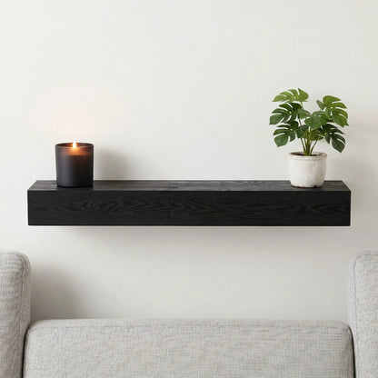 48in embossed black fireplace mantel wall-mounted floating shelf with candle and plant on Tampa Home & Garden Store