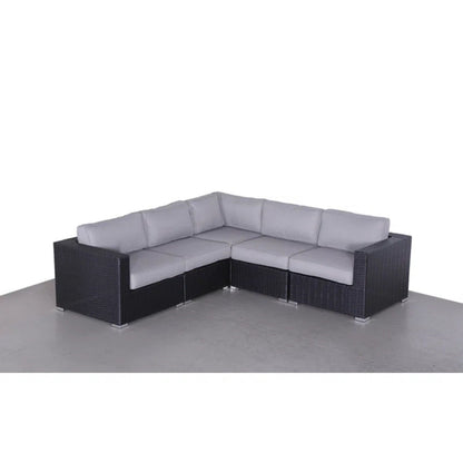 Luxurious wicker L-shaped stationary sectional by HouseOfZazla with light gray Sunbrella cushions on Tampa Home & Garden Store