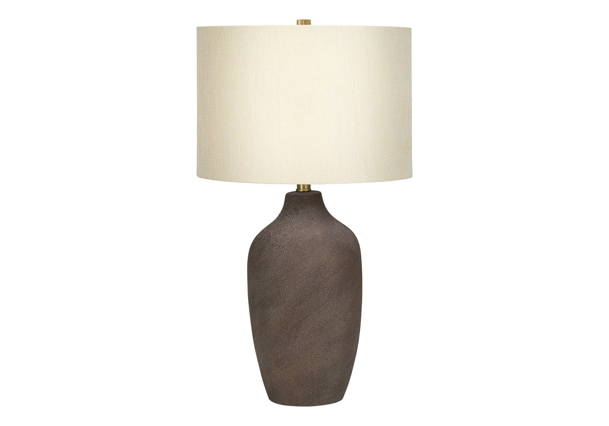 Table lamp with textured brown ceramic base, beige fabric shade, brass finial on Tampa Home & Garden Store