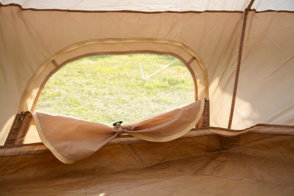 Beige Oxford Bell Tent interior with circular zippered doorway for family camping on Tampa Home & Garden Store