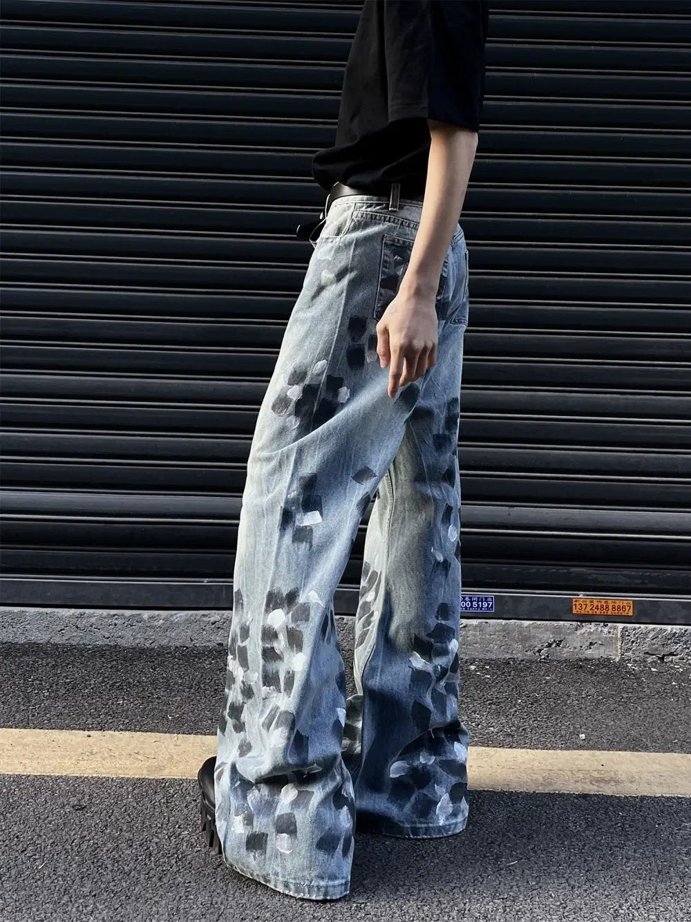Slightly flared wide-leg jeans in light blue denim with dark blotch pattern on Tampa Home & Garden Store