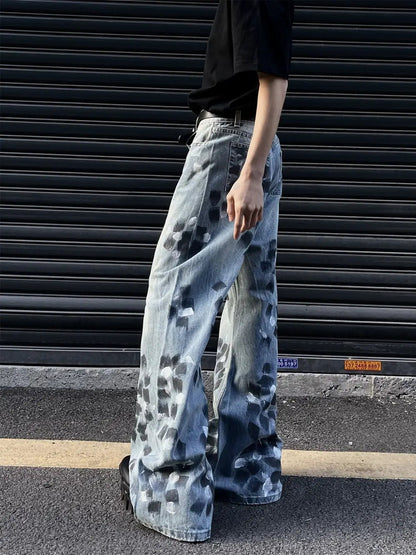 Slightly flared wide-leg jeans in light blue denim with dark blotch pattern on Tampa Home & Garden Store