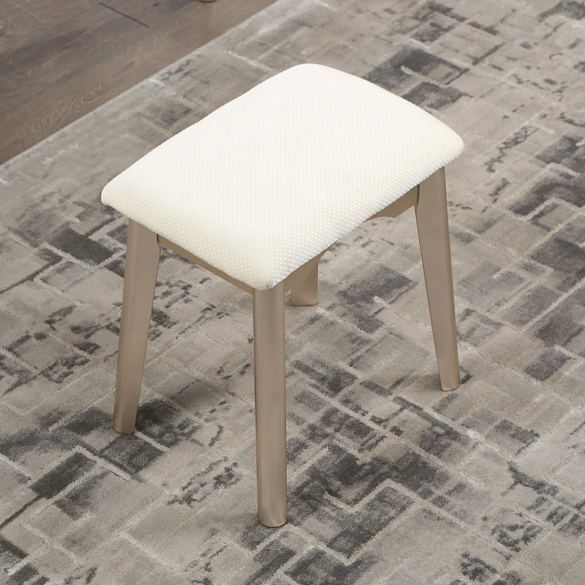 Maly contemporary wood vanity stool with cream dotted upholstery and gold legs on Tampa Home & Garden Store
