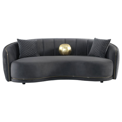 Curved luxe sofa with diamond quilting, dark gray velvet, gold piping, 2 cushions on Tampa Home & Garden Store