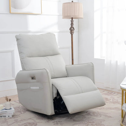 Power swivel rocker recliner chair in light gray leather with USB ports, shown in a living room on Tampa Home & Garden Store