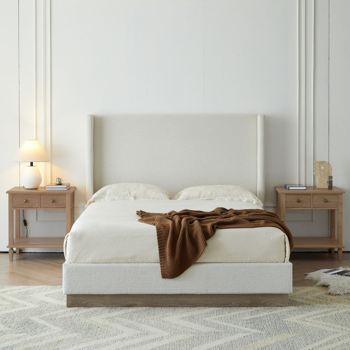 Hosford upholstered wingback bed with wood base in beige fabric; 2 oak nightstands on Tampa Home & Garden Store