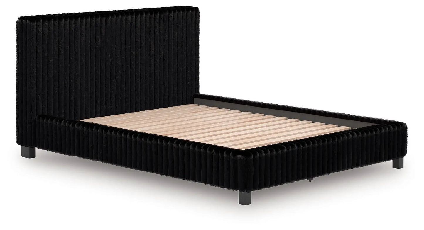 Zuraleus Upholstered Bed by Unique Piece Furniture in black velvet with tufted headboard on Tampa Home & Garden Store