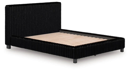 Zuraleus Upholstered Bed by Unique Piece Furniture in black velvet with tufted headboard on Tampa Home & Garden Store