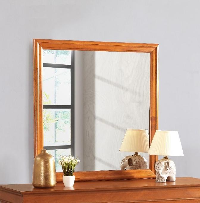 Traditional wall mirror with natural wood veneer frame in warm brown on a dresser on Tampa Home & Garden Store