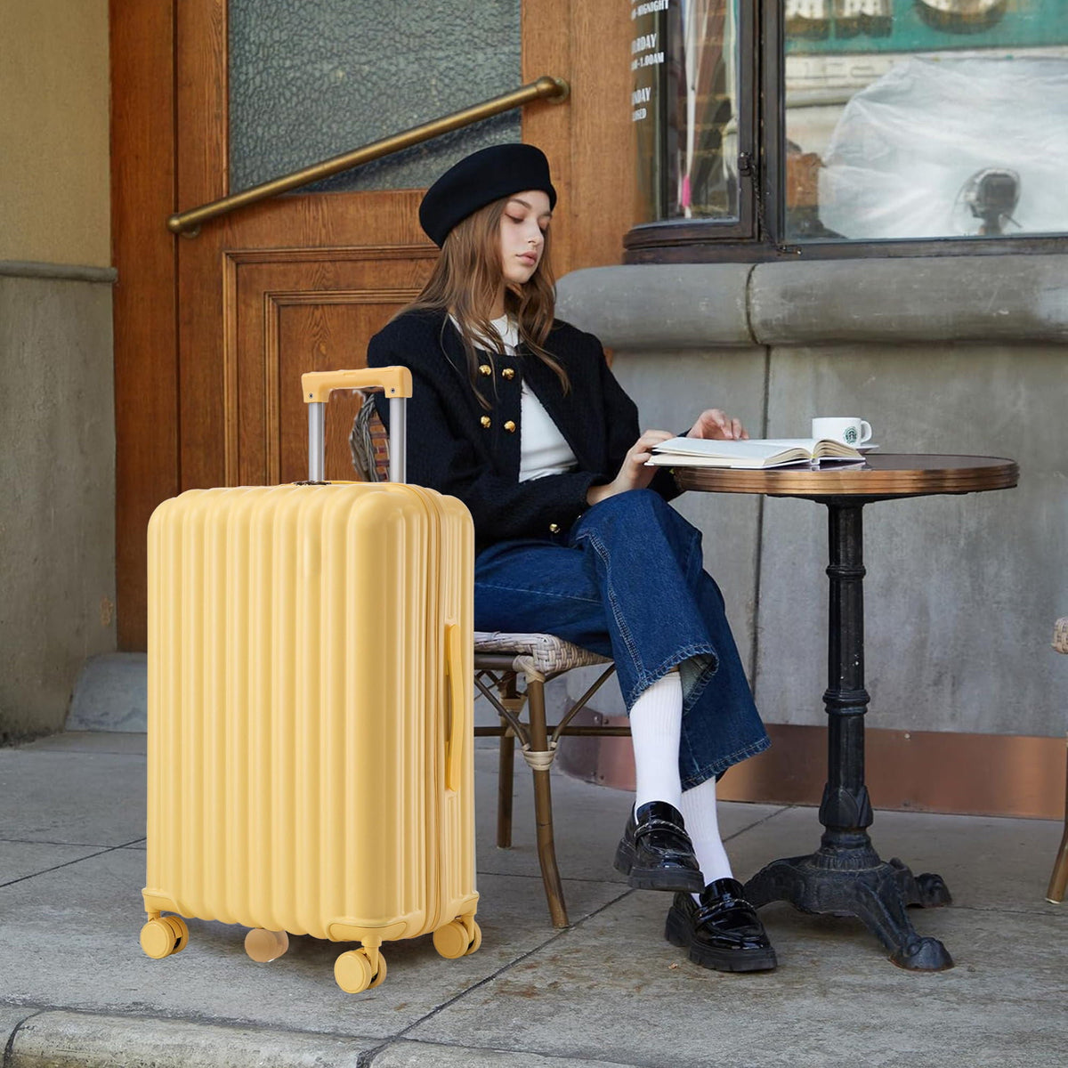 Yellow ribbed hard-shell spinner luggage with four wheels carry-on size on Tampa Home & Garden Store