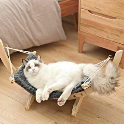 Solid wood pet hammock bed with plush nest, cat lounging in hanging bed by Sell My Stuff on Tampa Home & Garden Store