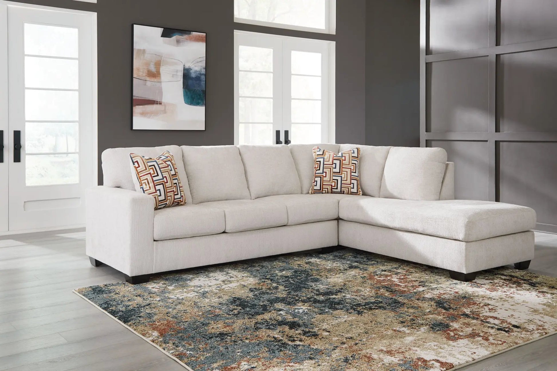 Aviemore sectional in beige fabric with colorful geometric pillows by Unique Piece Furniture on Tampa Home & Garden Store