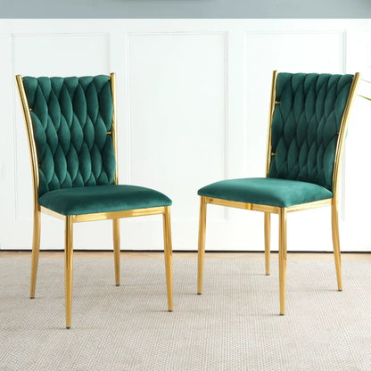 Pair of emerald green velvet dining chairs with gold metal frames and diamond tufted backs on Tampa Home & Garden Store