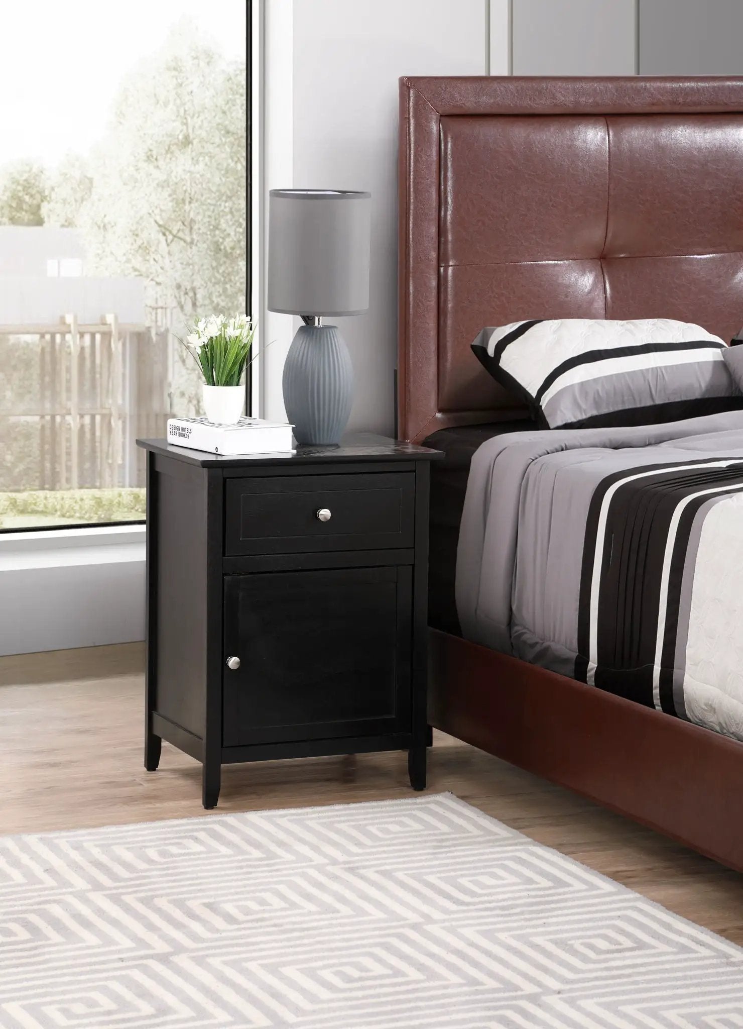 1 Drawer / 1 Door Nightstand black finish with silver hardware beside a gray lamp and plant on Tampa Home & Garden Store