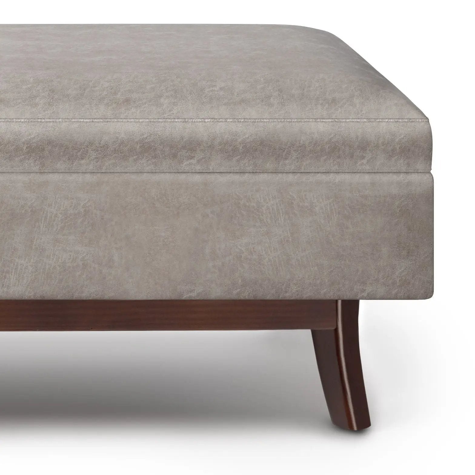 Owen upholstered rectangular storage ottoman in taupe textured fabric with dark wood legs on Tampa Home & Garden Store