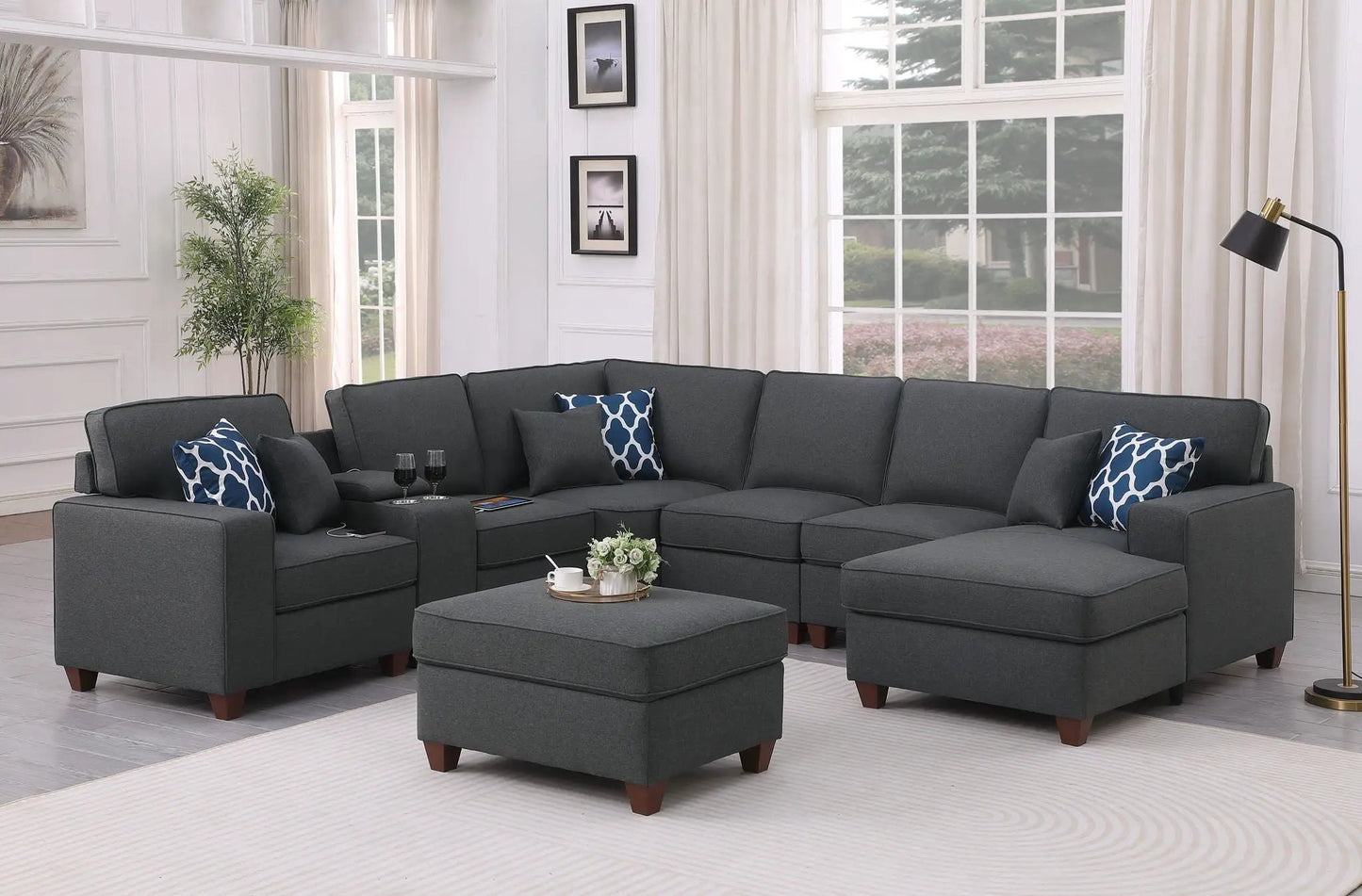 Tina 8 Piece Upholstered Sectional With Ottoman in dark gray fabric with blue pillows on Tampa Home & Garden Store