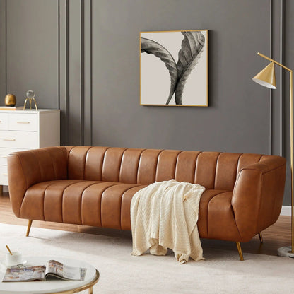 Ava sofa tan leather stationary with gold legs and vertical channel tufting on Tampa Home & Garden Store