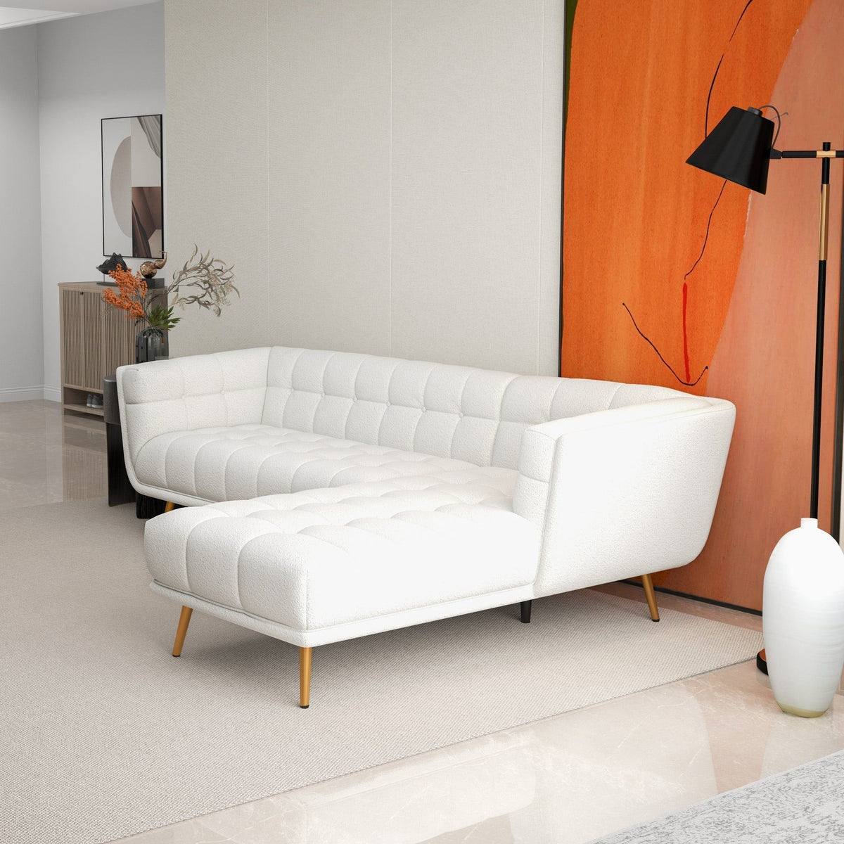 L-shaped tufted sectional sofa with mid-century modern lines and wooden legs in white fabric on Tampa Home & Garden Store