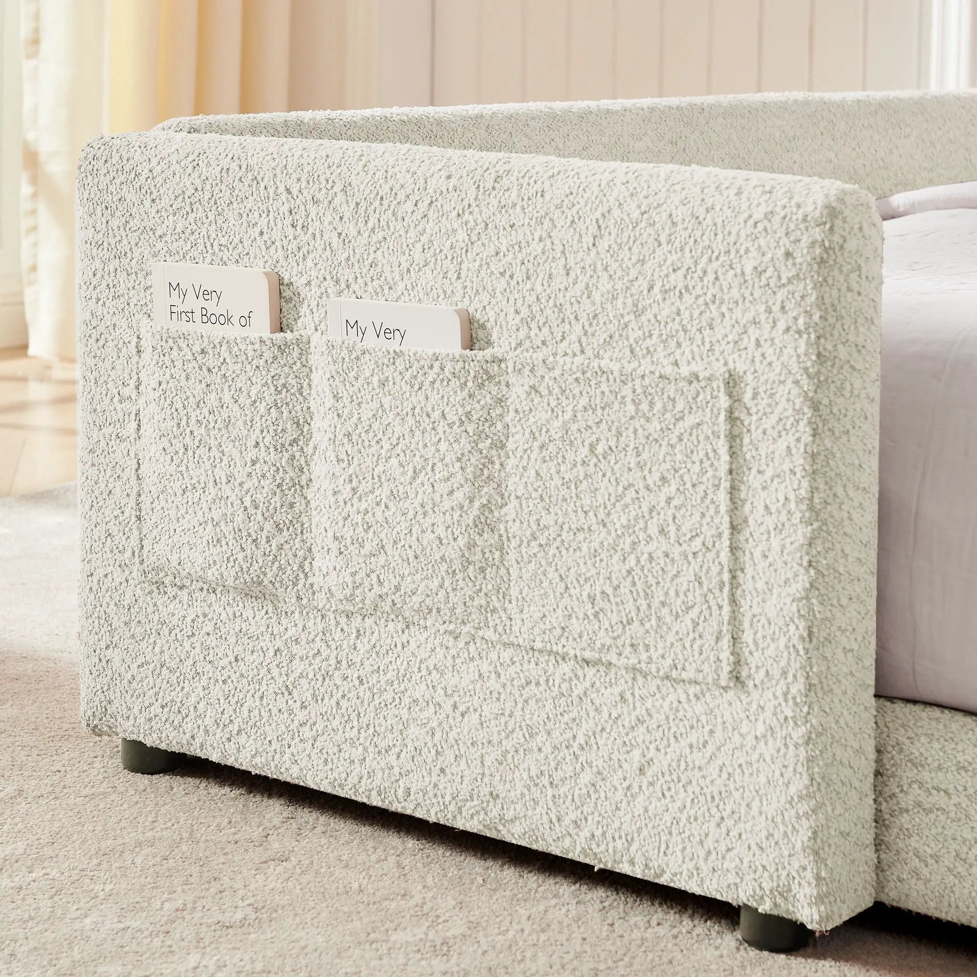 Cute Rabbit Ear upholstered platform bed frame with safety rail and book pockets on Tampa Home & Garden Store