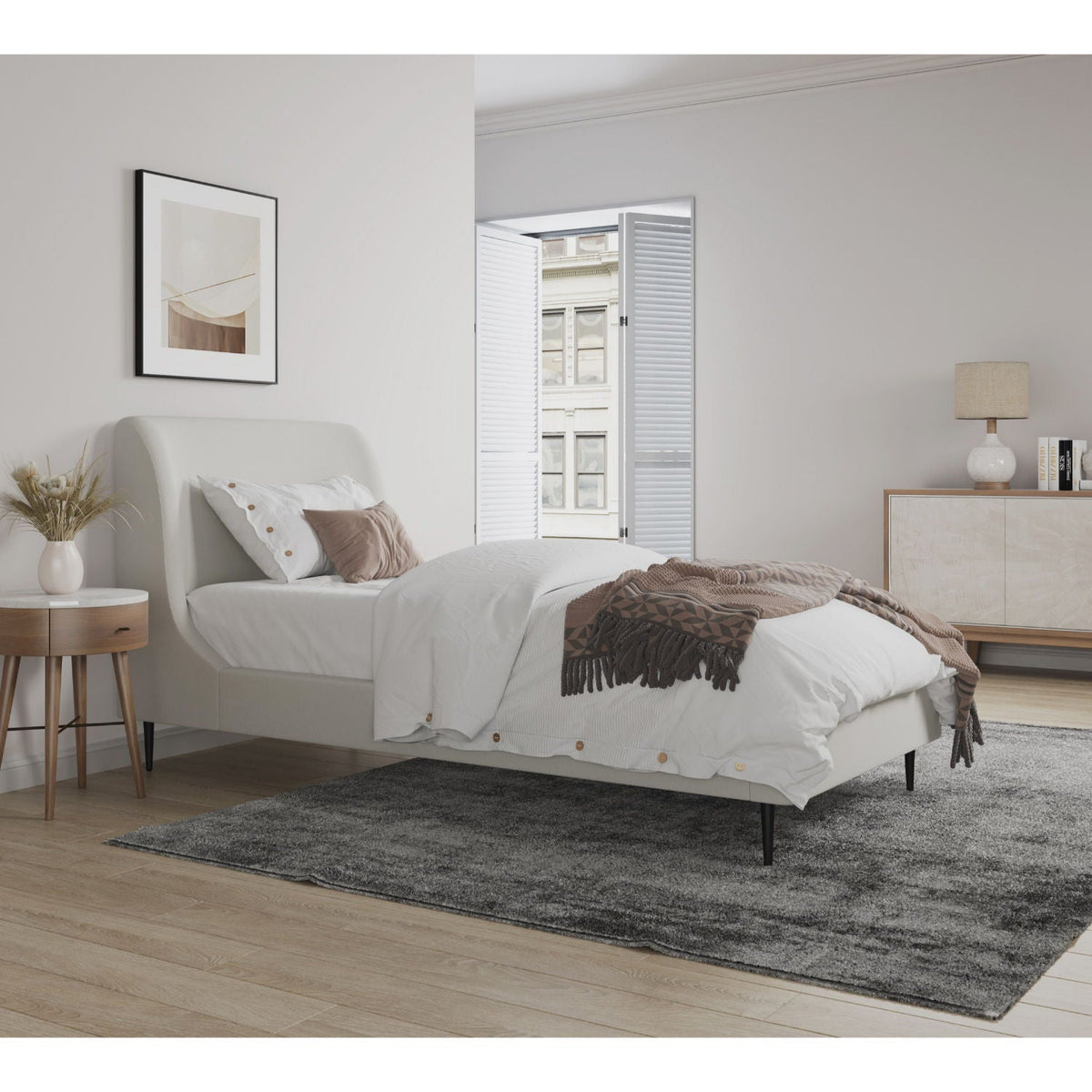 Heather upholstered bed with curved headboard in light beige fabric, white bedding, brown throw on Tampa Home & Garden Store