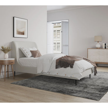 Heather upholstered bed with curved headboard in light beige fabric, white bedding, brown throw on Tampa Home & Garden Store