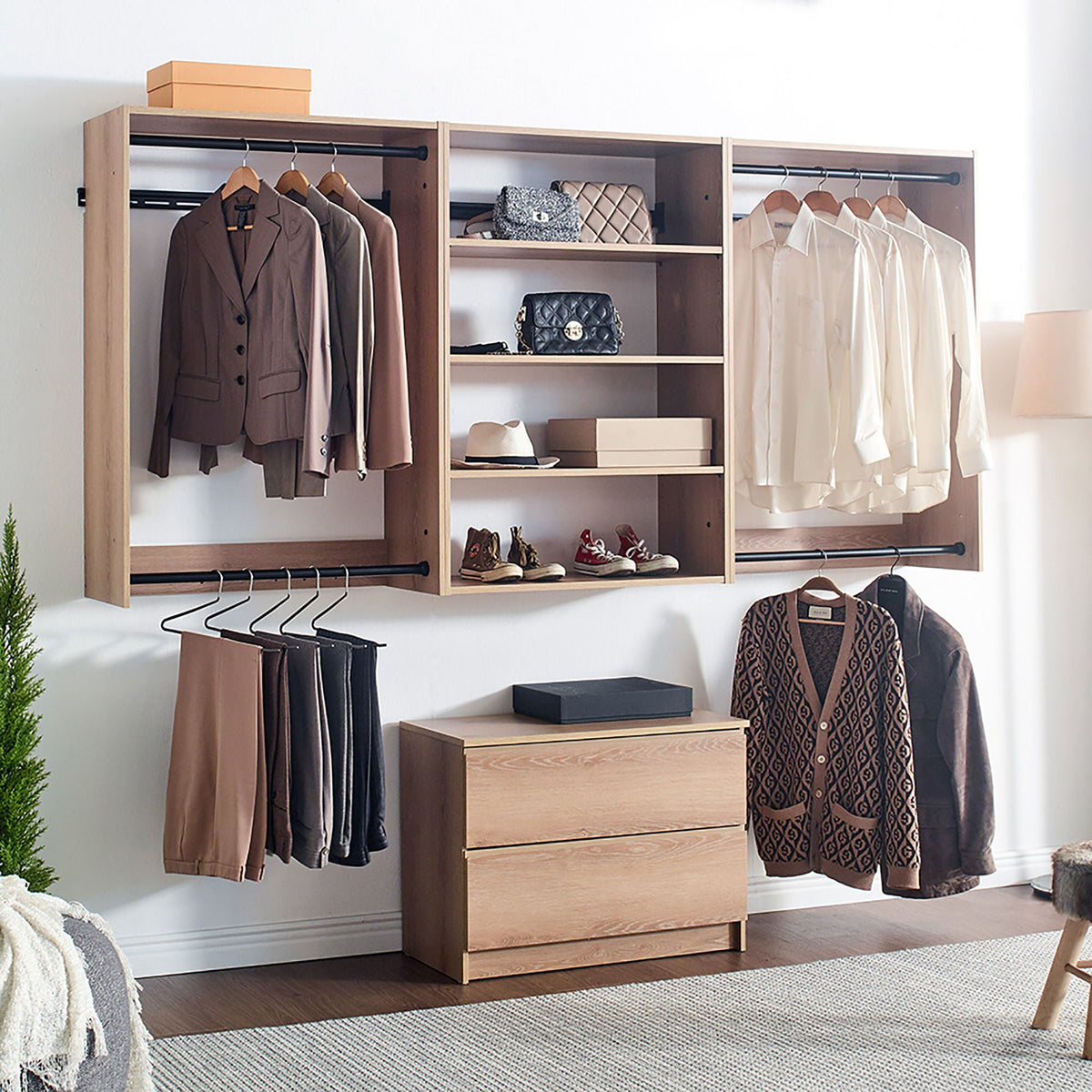Wall mounted wood closet system with three modular wardrobes in light brown and hanging rails on Tampa Home & Garden Store