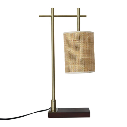 Bedroom table lamp with bronze metal stand and woven wicker shade on dark wood base on Tampa Home & Garden Store