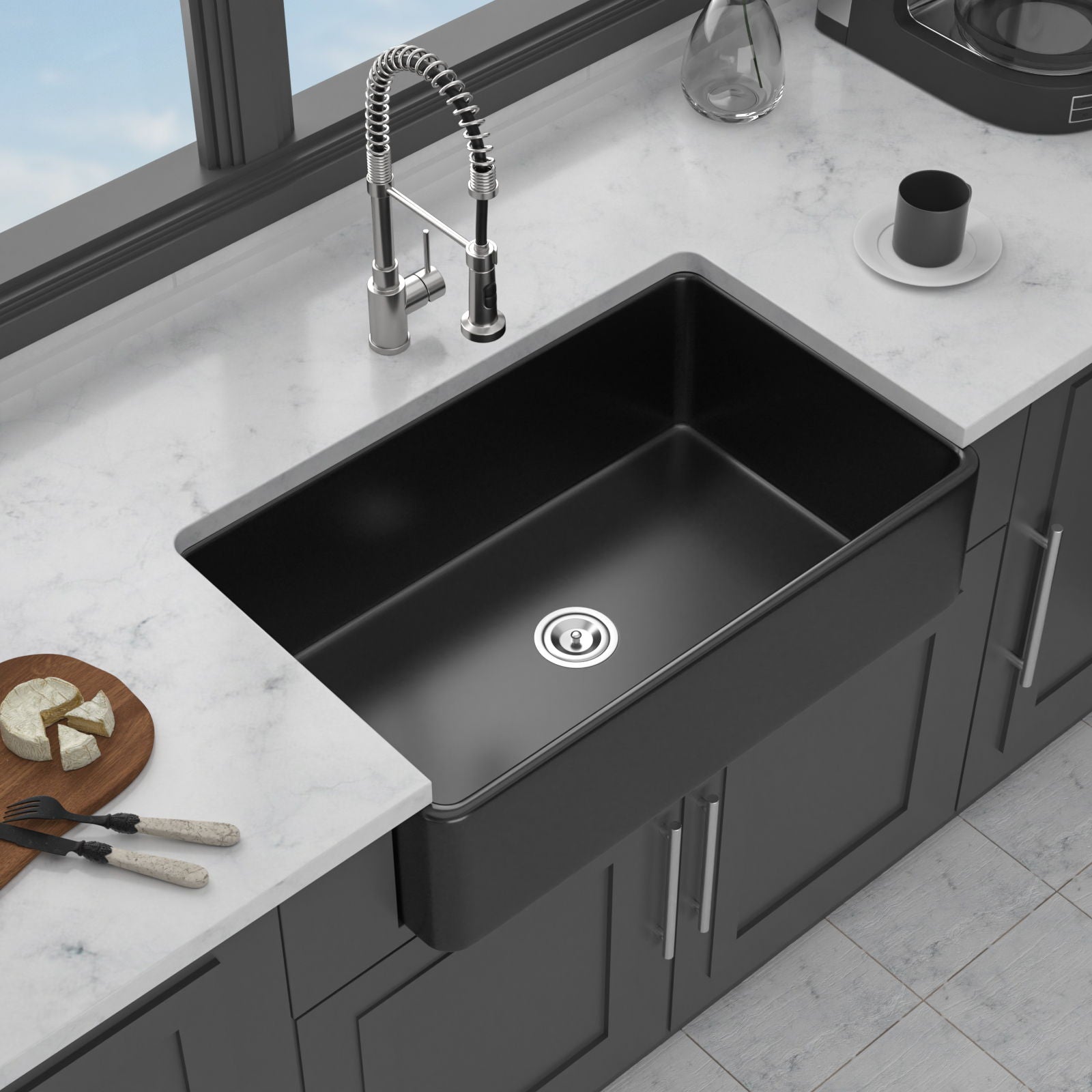 Undermount black kitchen sink with chrome spring faucet on a marble countertop in a kitchen on Tampa Home & Garden Store