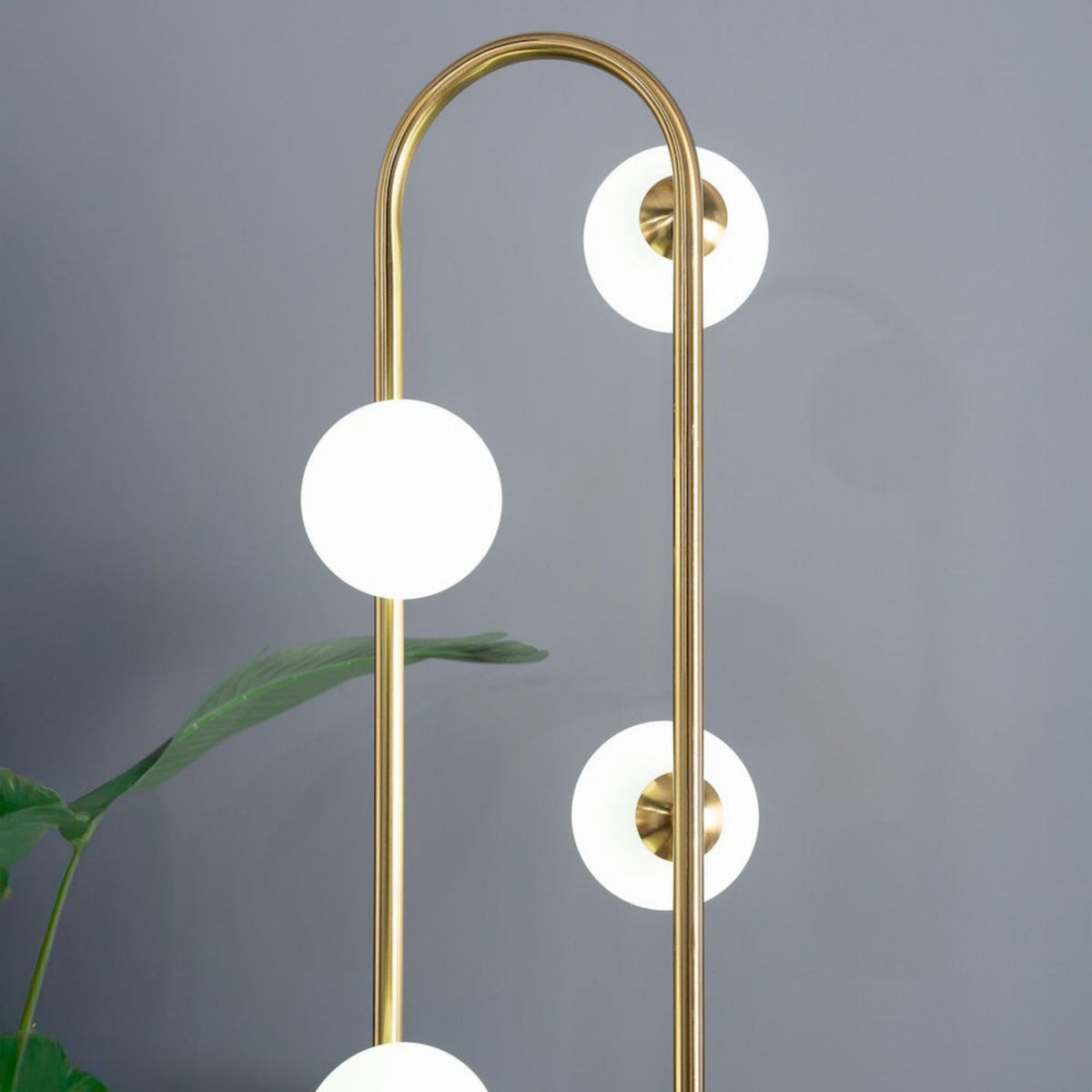 Artema Floor Lamp Gold by HouseOfZazla, modern brass arc floor lamp with white globe shades on Tampa Home & Garden Store