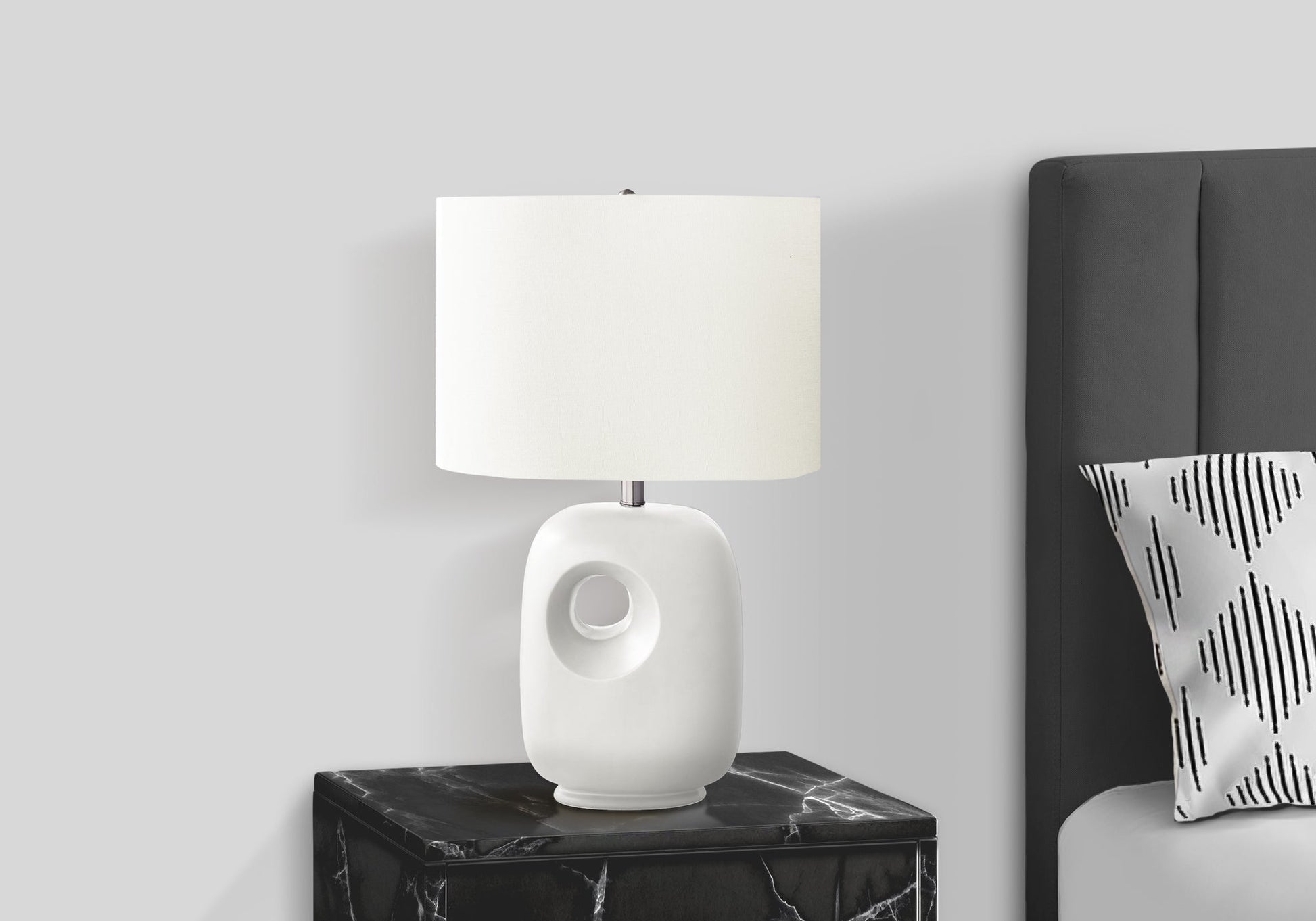 Contemporary white ceramic table lamp with ivory shade, 26H, on black marble nightstand on Tampa Home & Garden Store
