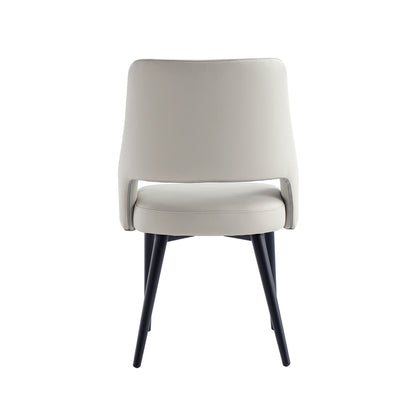 Tremont Arm Dining Chair with steel frame, beige faux leather, curved back, black legs on Tampa Home & Garden Store