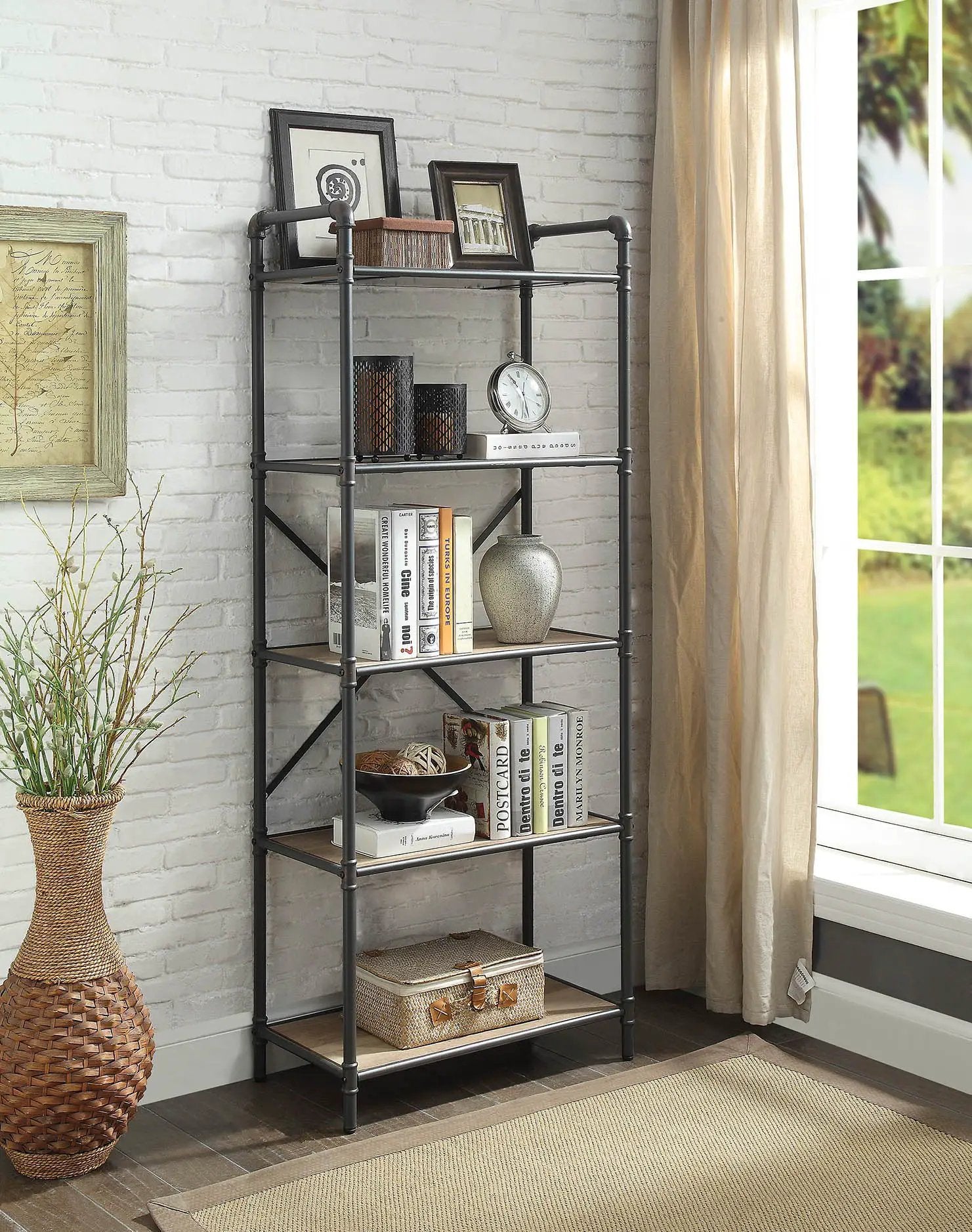 Itzel Bookshelf etagere in black metal with wood shelves, framed photos and books on Tampa Home & Garden Store