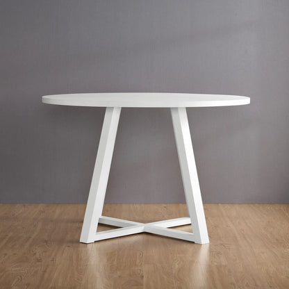 Edo white trestle dining table with angular legs by Unique Piece Furniture against a gray wall on Tampa Home & Garden Store
