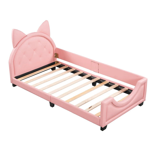 Twin pink upholstered daybed with carton ears headboard tufted panels and a slatted bed base on Tampa Home & Garden Store