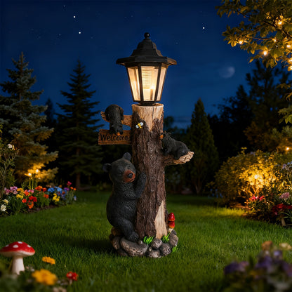 Black bear statue garden sculpture with welcome sign and solar lantern on carved tree trunk on Tampa Home & Garden Store